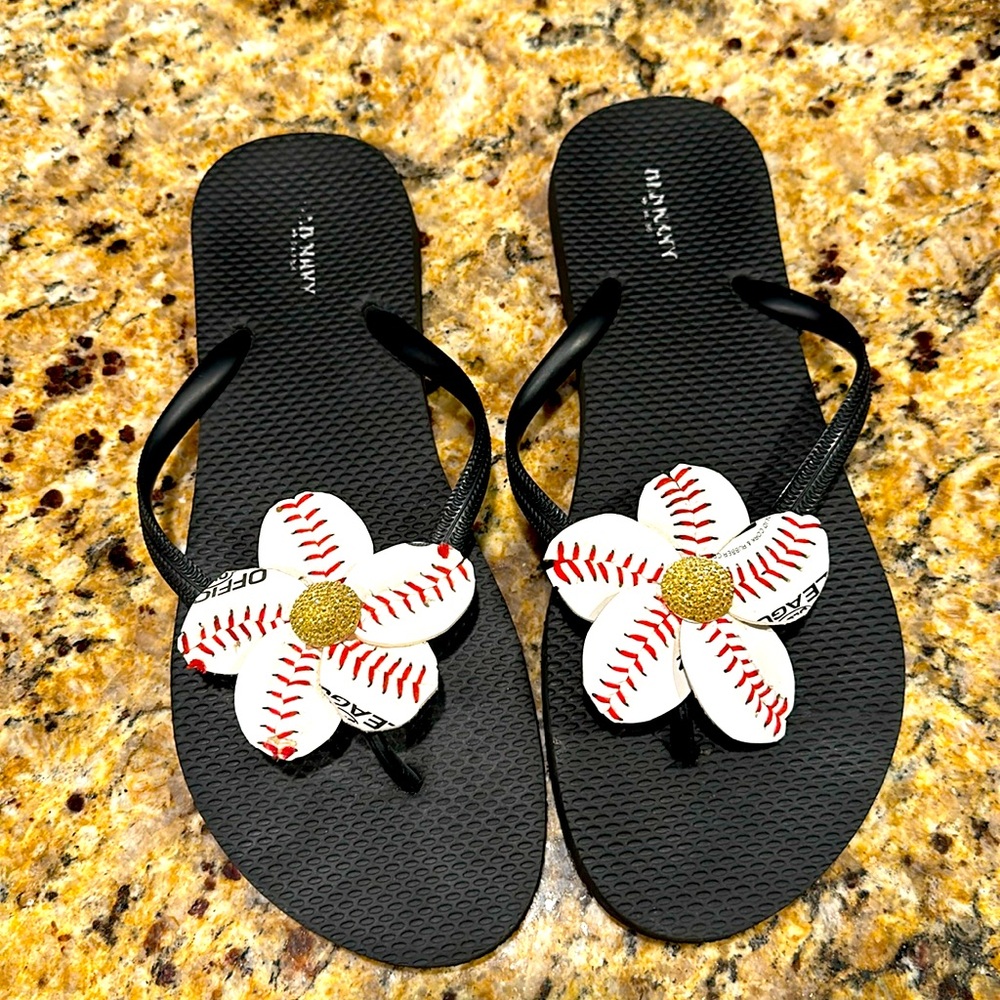 Baseball flip flops made with baseball leather.
